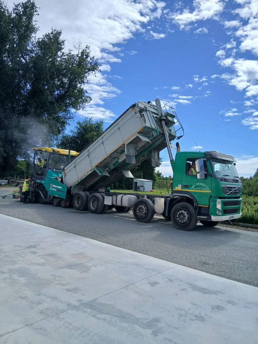 D&R Works truck tipping aggregate for a roading crew